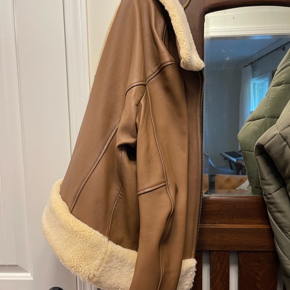 Leather Jacket. Lined. Shearling cuff, neck collar. Can wear any type of blouse